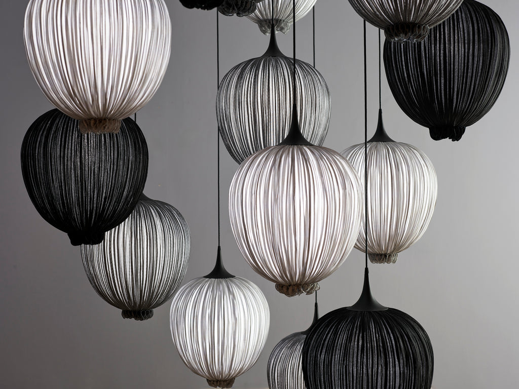 Dippa pendants in smoke, silver, and Coal. 