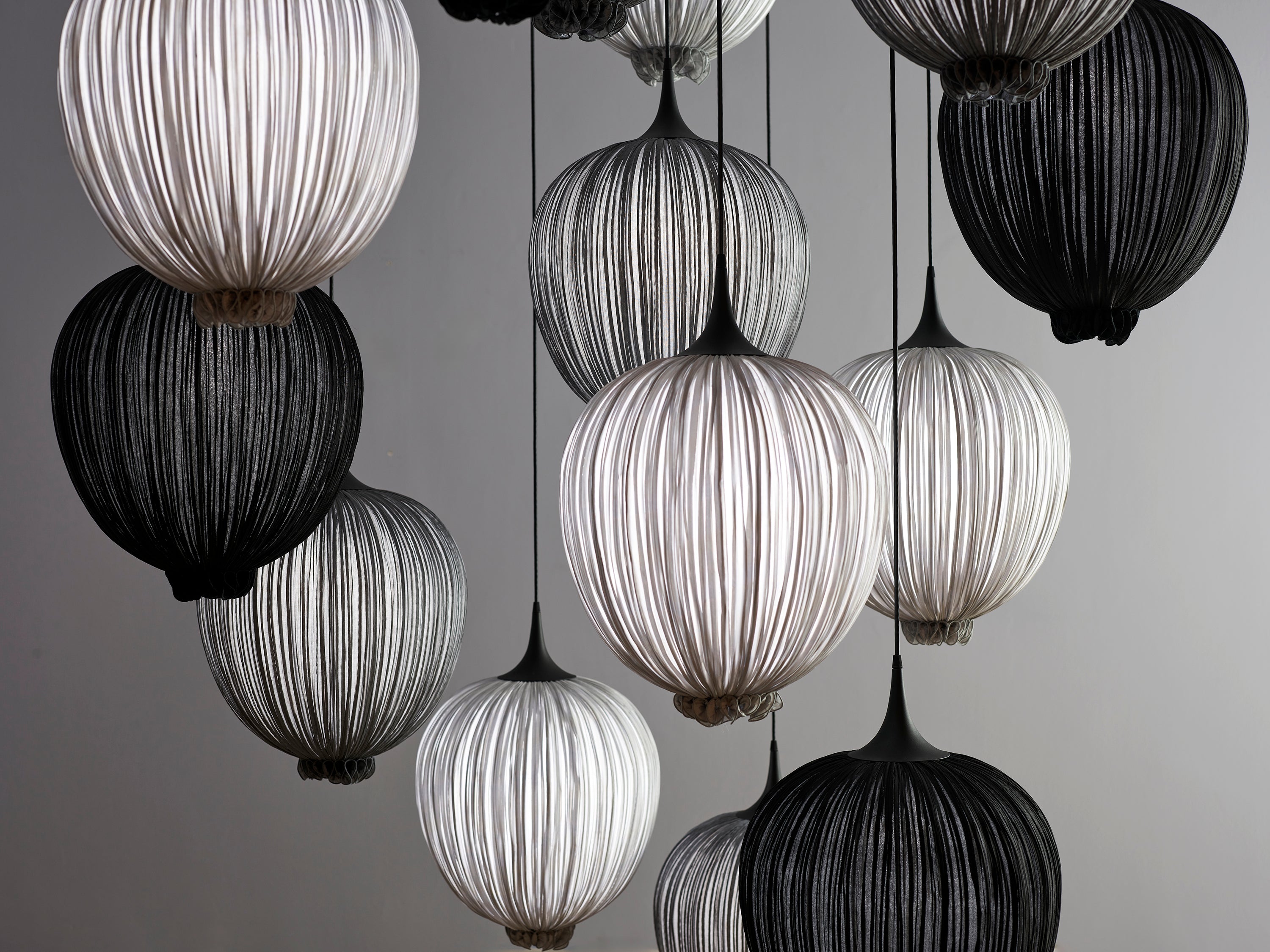 Dippa pendants in smoke, silver, and Coal. 