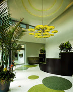 Sunsa 21 hotel lobby chandelier of layered Grass silk discs above a curved reception desk, Aqua Creations