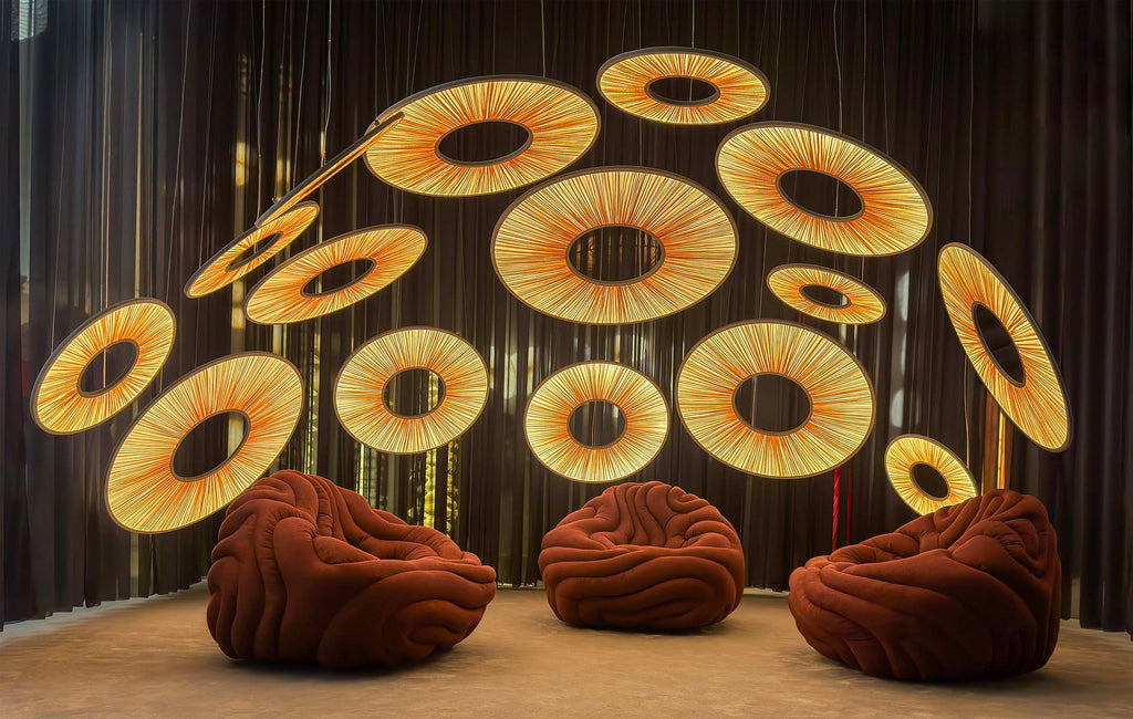 Manhattan Pendant light installation Euroluce 2025 (sizes 60,90,120cm) with Gladis Armchair