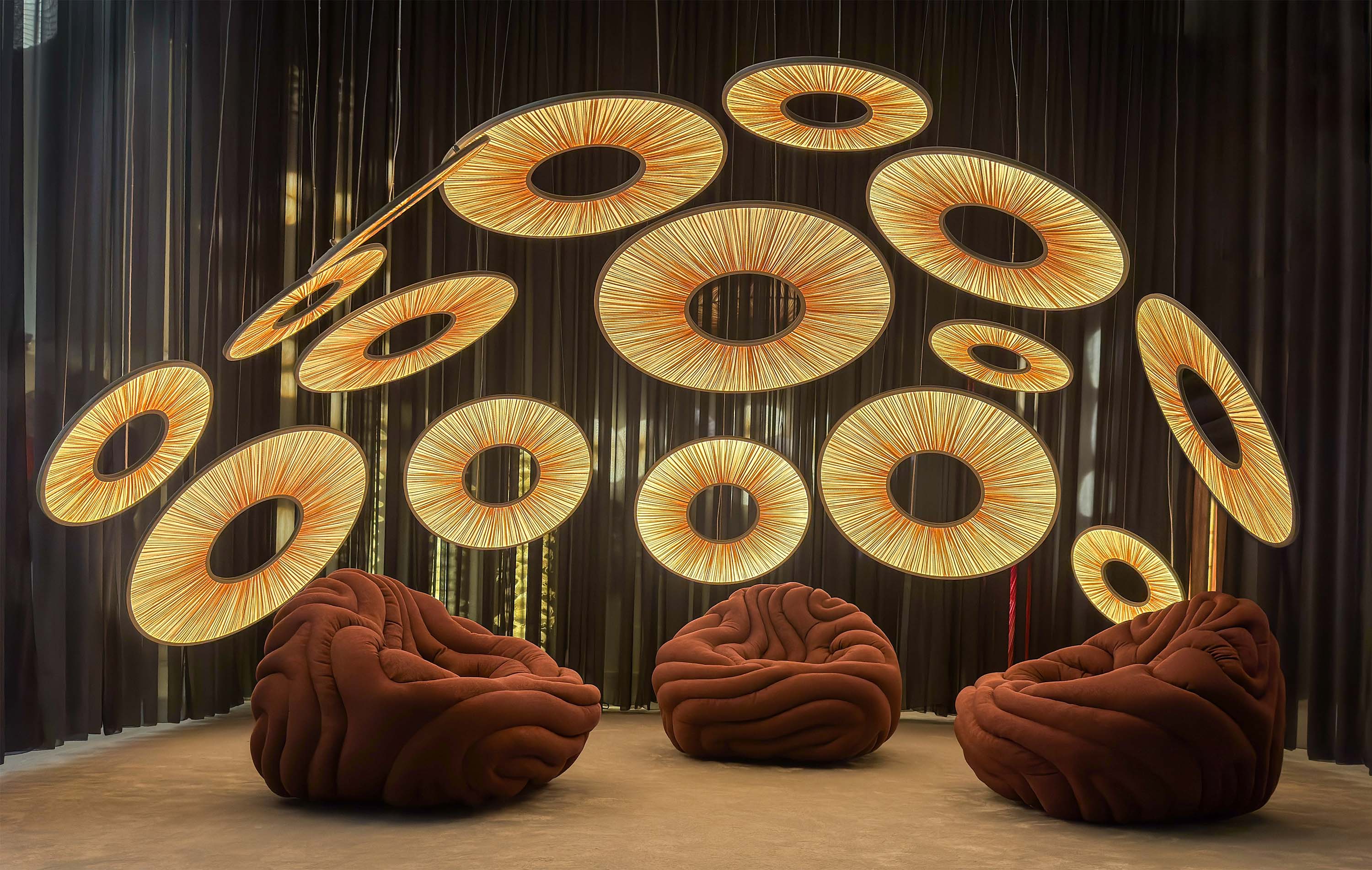 Manhattan Pendant light installation Euroluce 2025 (sizes 60,90,120cm) with Gladis Armchair